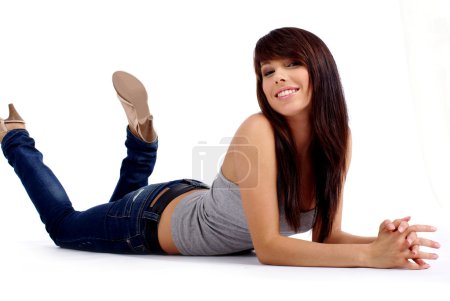 Fashion woman portrait where she is smiling on the floor over a