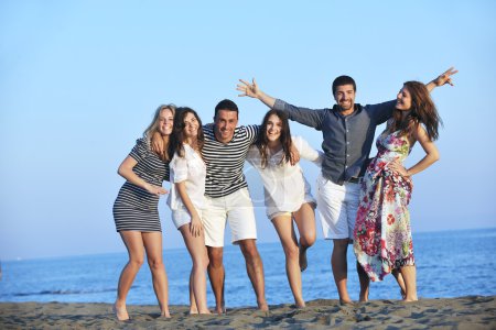 Happy young group have fun on beach