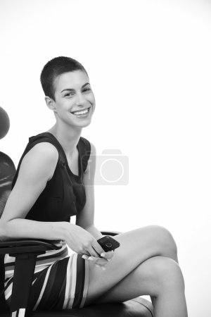 Brunette female model posing on business chair