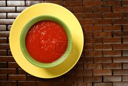 Tomato soup in colorful dish