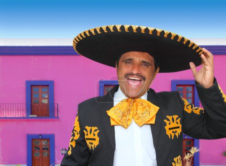 Charro mariachi portrait singing in mexican house