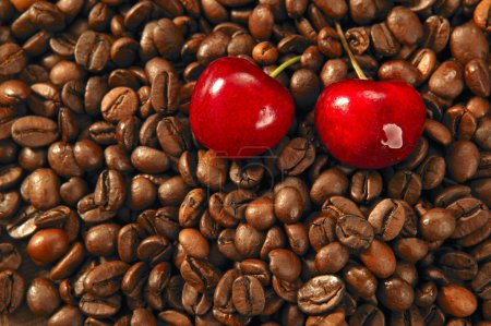 Toasted coffe beans and red cherry