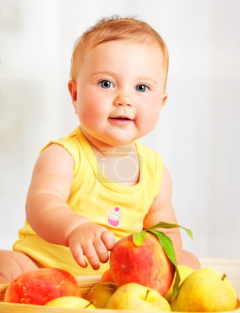 Little baby choosing fruits