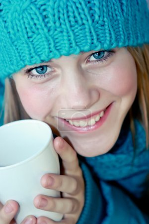 Girl with a cup of hot tea