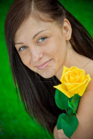 Beautiful smiling woman with a flower
