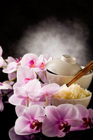 Asian rice dish with orchid flowers