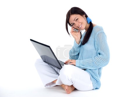 Girl with cellphone and laptop