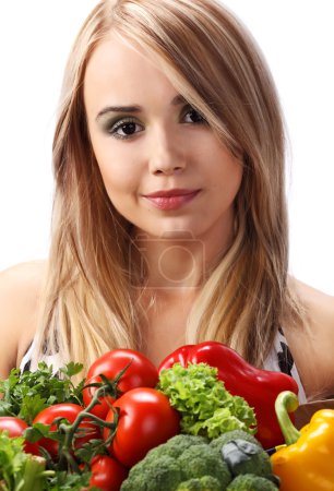 Woman holding fresh vegetables
