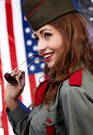 Sexual pinup woman in military clothing