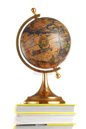 Antique globe on books