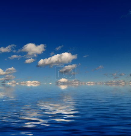 Blue sky with white clouds and abstract water reflection in nature background