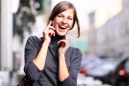 Young lady talking on mobile phone
