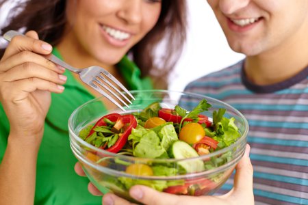 Couple eating vegetable salad