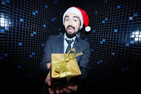 Businessman offering Christmas gift