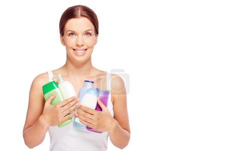 Woman with body care cosmetics