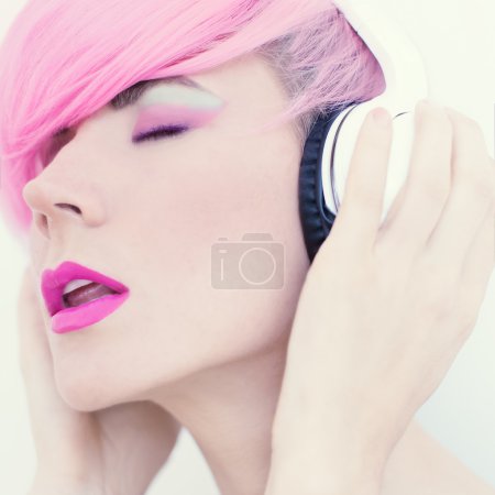 Sensual girl in stylish headphones