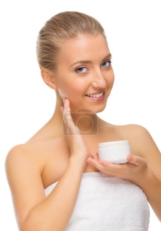 Young smiling girl with body cream