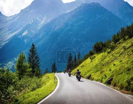Moto racers on mountainous road
