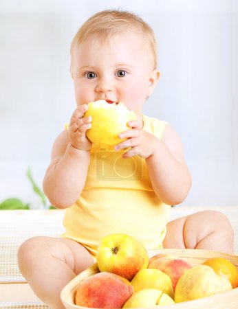 Cute baby with fruits