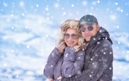 Happy couple under snowfall