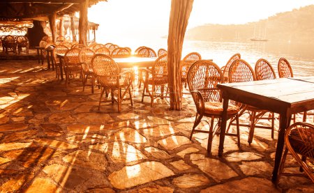 Seaside cafe in sunset light
