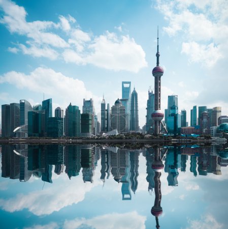 cityscape of modern city with reflection in shanghai
