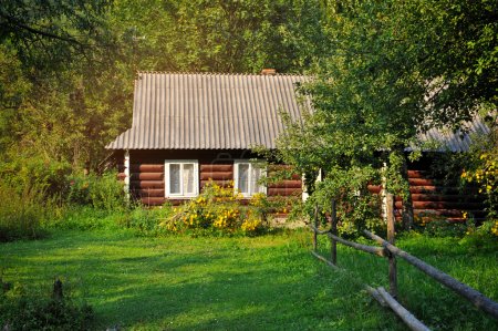 Old village house in summer day