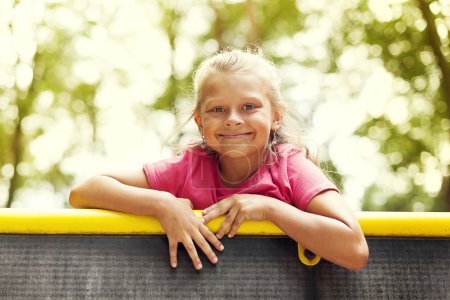 Portrait of little girl on playground