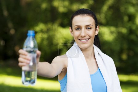 Young woman with bottle of water