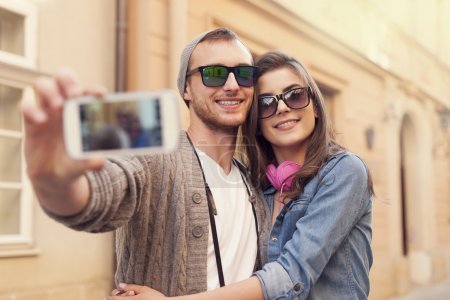 Couple taking selfie by mobile phone