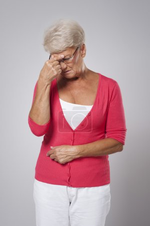 Woman suffering from strong headache