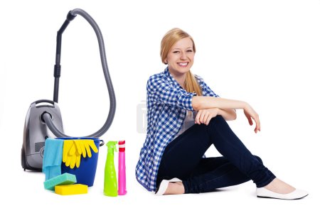 Portrait of sitting woman with accessories for cleaning