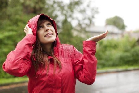 Young woman in raincoat