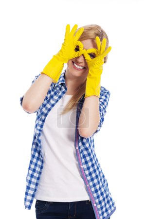 Cheerful woman with protective glove making hand gesture