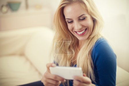 Happy woman with mobile phone