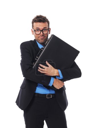 Frightened man firmly clutching his briefcase