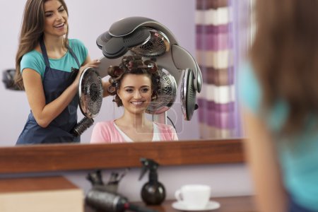 Customer under hair dryer