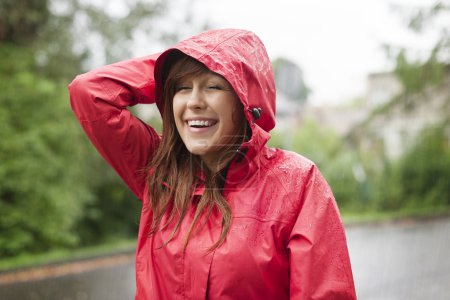 Young woman in raincoat
