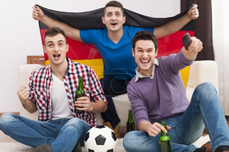 Men cheering football match