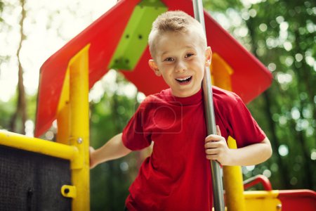 Cheerful little boy on playground