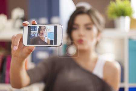Woman taking selfie photo