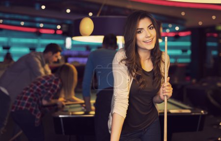 Woman in billiard club