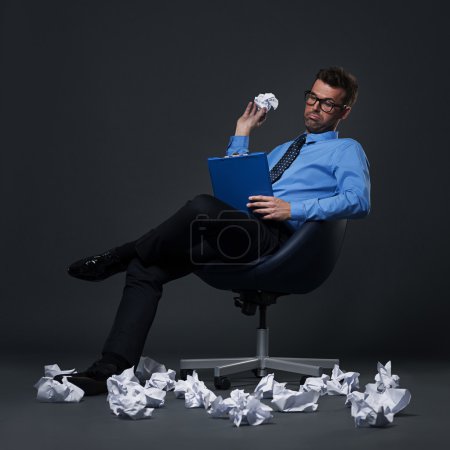 Businessman throwing a crumpled paper