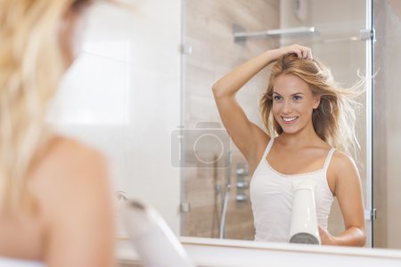 Woman drying hair