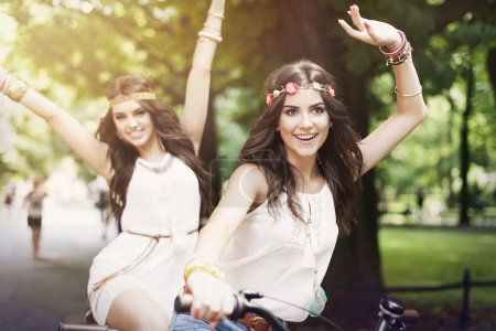 Hippie girls on bike
