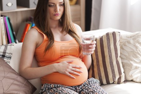 Pregnant young woman with nausea