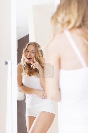 Woman pointing on reflection