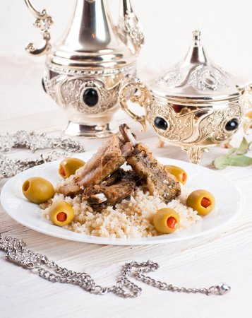 Moroccan tagine with lamb ribs, couscous and olives