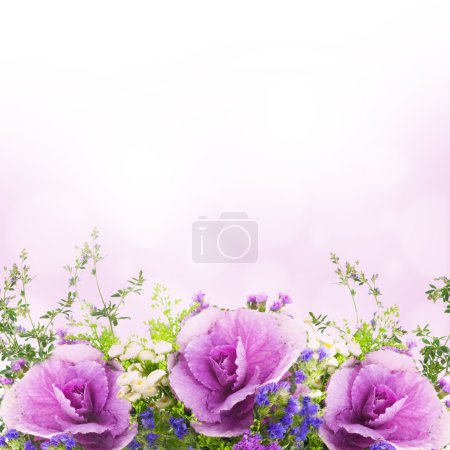 A spring decorative cabbage is in a bouquet, floral background