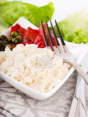 Rice with green-stuffs on a festive table